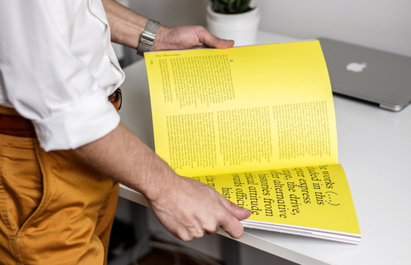 Yellow book man holding